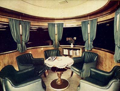 Interior of semi-circular observation rail car.